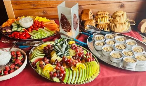 a table topped with lots of different types of food at Ahmic Lake Resort in Magnetawan