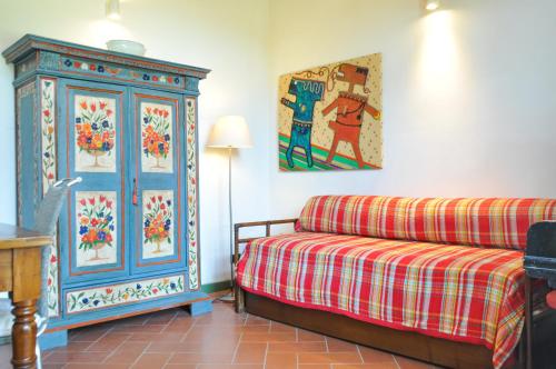 a living room with a couch and a painting on the wall at Casa Alta in Pistoia