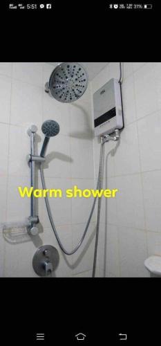 a shower in a bathroom with a shower at Davao Condo Chateau Soleil in Davao City