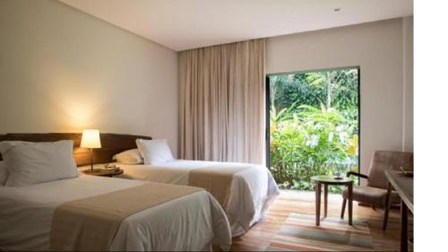 Ένα ή περισσότερα κρεβάτια σε δωμάτιο στο Hotel Villa Amazônia