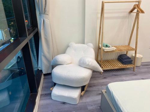 a pile of pillows sitting on a chair in a room at Nón House in Hanoi