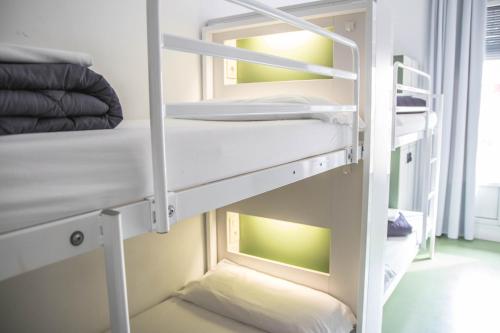 a room with two bunk beds in a room at Sant Jordi Hostels Rock Palace in Barcelona