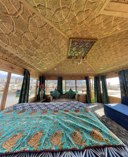 a bedroom in a bus with a bed and windows at Smith palace group of houseboats in Srinagar