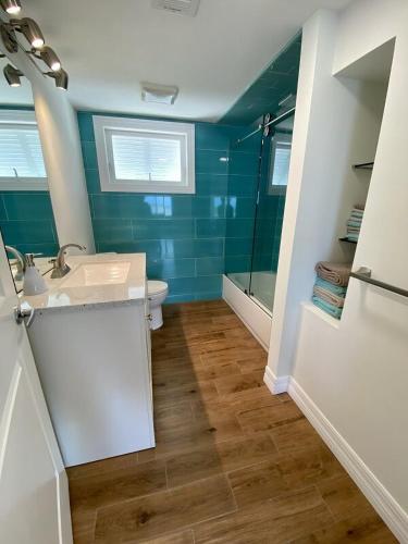 a bathroom with a sink and a toilet and a shower at Seascape Point in Marathon