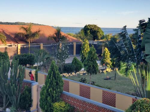 an aerial view of a park with trees and plants at Alice Gardens & Campsite in Entebbe
