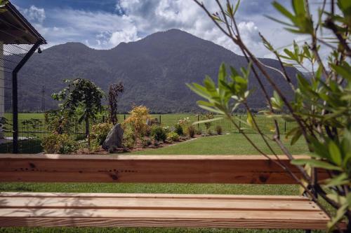 a wooden fence with a view of a mountain at Posthotel Erlerwirt in Erl