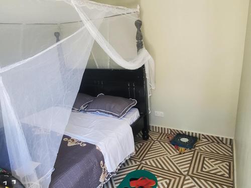 Ένα ή περισσότερα κρεβάτια σε δωμάτιο στο Alice Gardens & Campsite