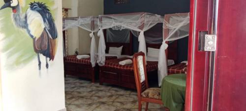 Ένα ή περισσότερα κρεβάτια σε δωμάτιο στο Alice Gardens & Campsite