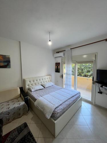 מיטה או מיטות בחדר ב-Kristi apartment