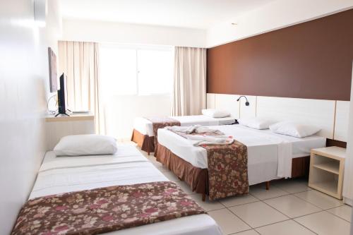 Katil atau katil-katil dalam bilik di Apartamento Le Jardin
