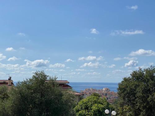 a view of a city with the ocean in the background at Villa Diamante in Diamante