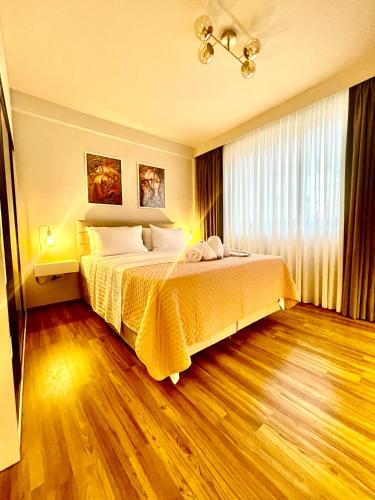 Ένα ή περισσότερα κρεβάτια σε δωμάτιο στο THE APPARTMENT iN THE CITY CENTER