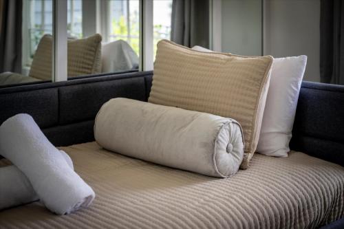 a pillow sitting on top of a couch with pillows at Lakefront Mountain Oasis in Dandridge