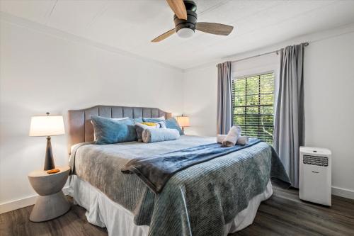 a bedroom with a bed and a ceiling fan at Lakefront Mountain Oasis in Dandridge