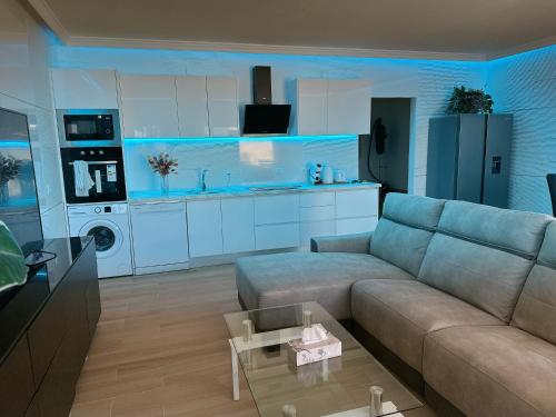 a living room with a couch and a kitchen at Villa Lele in Playa Blanca