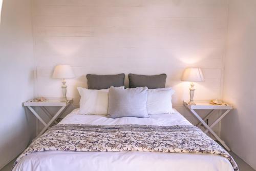 Ένα ή περισσότερα κρεβάτια σε δωμάτιο στο Sandpiper Shores - De Kelders Getaway