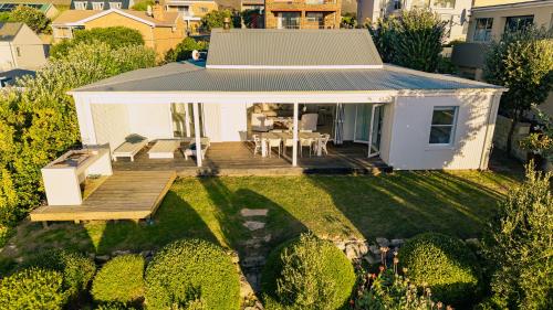 Κήπος έξω από το Sandpiper Shores - De Kelders Getaway