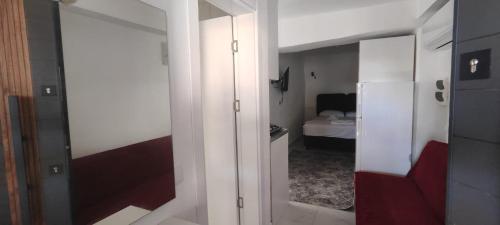 a room with a door to a room with a bedroom at Neşe &Alp Apart Pansiyon in Demre