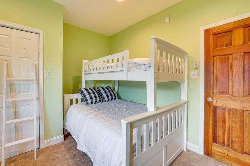 a bedroom with two bunk beds and a door at 1 Block to Inlet Beach Brigantine Family Home in Brigantine