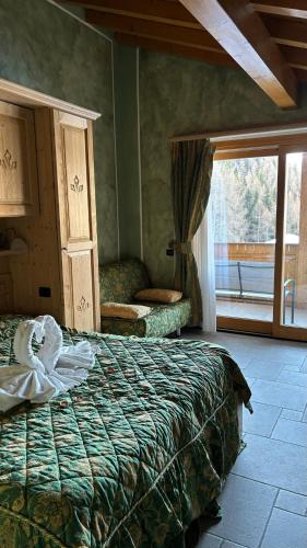 Ein Bett oder Betten in einem Zimmer der Unterkunft Boscone Suite Hotel