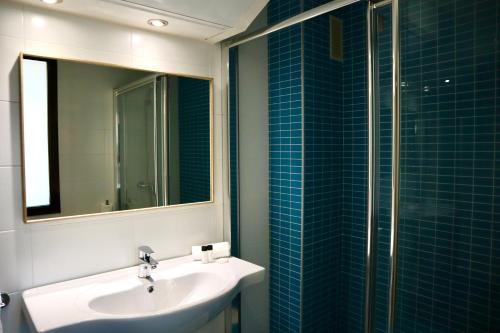 Ένα μπάνιο στο Apartahotel Punta Calera