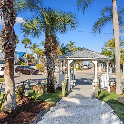 a gazebo and palm trees on a street at Captiva Beach Resort (open private beach access) in Sarasota