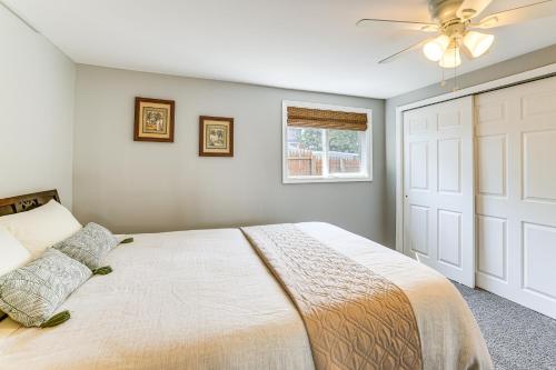 a bedroom with a bed and a ceiling fan at Dock and Backyard Bar Spacious Barnegat Bay Retreat in Waretown