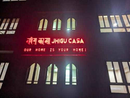 a sign on the side of a building at JhiguCasa - Home away from home in Kirtipur