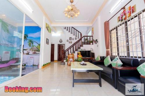 a living room with a couch and a table at Nhà Nghỉ Mát Trung Tâm Bãi Sau HM XANH in Vung Tau