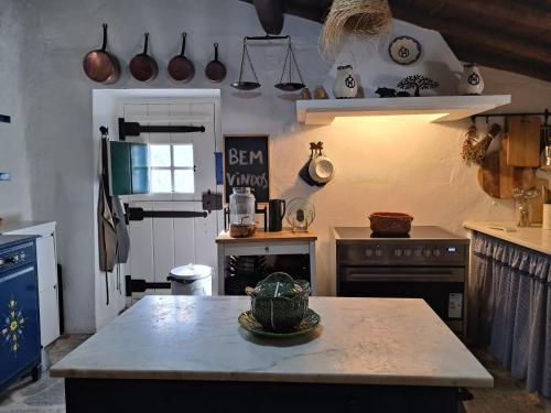 a kitchen with a stove and a counter top at Monte Horta da Velhinha in Redondo