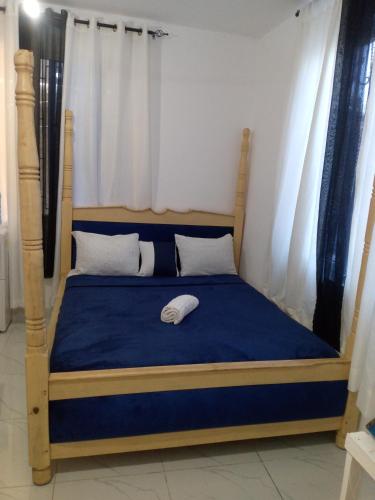 Ένα ή περισσότερα κρεβάτια σε δωμάτιο στο Fahari Homes