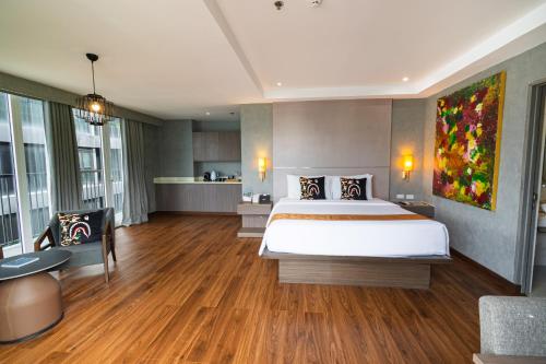 Una cama o camas en una habitación de S Resort El Nido Managed by H Hospitality Group