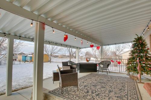 a pergola with a christmas tree on a patio at Farr West Apartment on Farm Less Than 25 Mi to Ski Resorts in Farr West
