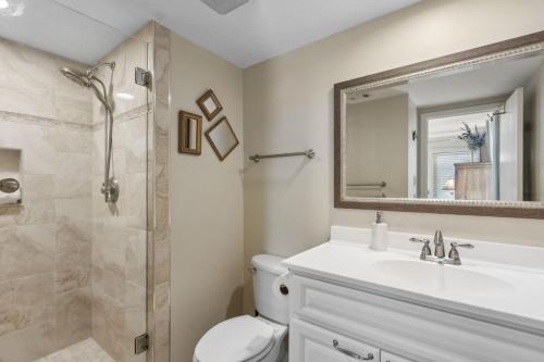 a bathroom with a toilet and a sink and a shower at Amelia Surf and Racquet Club Condo - Ocean View - 2nd Floor - Pools - Tennis Courts - Sleeps 8 in Fernandina Beach