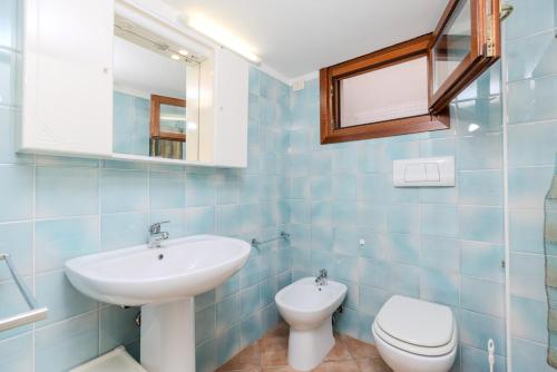 Ένα μπάνιο στο Villa Capo Coda Cavallo con Piscina