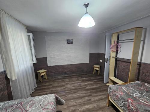 a room with a bed and a room with a mirror at Marselo's happy house in Tskaltubo