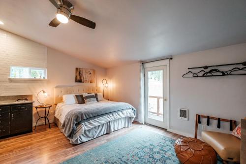 a bedroom with a bed and a large window at PNW Scenic Loft with Kitchenette in Philomath