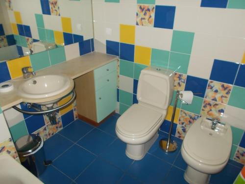 a bathroom with a toilet and a sink at T1 e T2 Marina Albufeira apartments in Albufeira