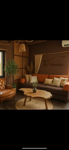 a living room with a couch and a coffee table at Petrovf Place 