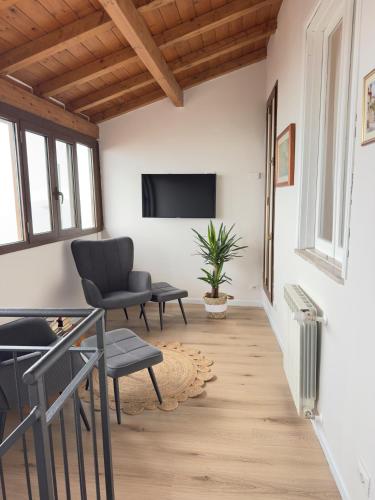 a living room with a tv on the wall at La Terrazza Sulla Valle in Sgurgola