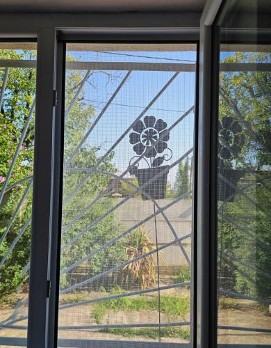 a stained glass window with a flower on it at Marselo's happy house in Tskaltubo