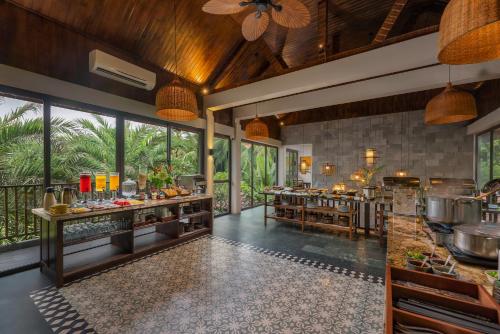 a restaurant with a buffet in a resort kitchen at Coco Island Resort Ninh Binh in Ninh Binh