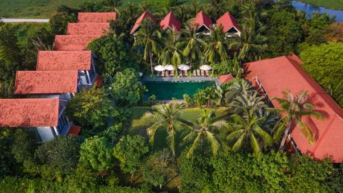 an aerial view of a resort with a swimming pool at Coco Island Resort Ninh Binh in Ninh Binh