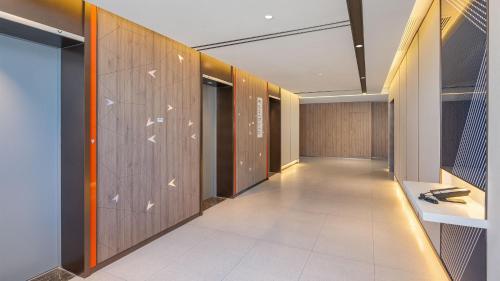 Ένα ή περισσότερα κρεβάτια σε δωμάτιο στο Holiday Inn Express Chenzhou Suxian by IHG