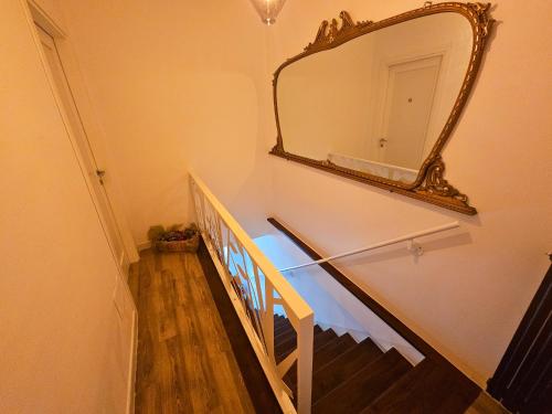 a mirror on the wall of a room with a bed at B&B Al 17 in Sturno