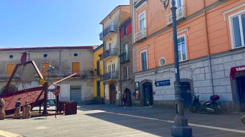 a city street with buildings and a playground at La Finestra Sul Vulcano in Roccamonfina