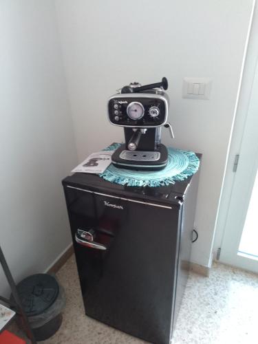 a camera sitting on top of a small refrigerator at Zia Maria in Bari