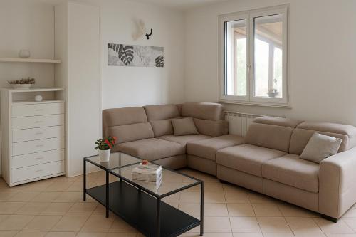 a living room with a couch and a coffee table at Casa vacanze Anna a due passi da Otranto in Uggiano la Chiesa