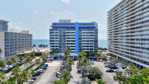an aerial view of a city with palm trees and buildings at Ocean Manor Beach Resort in Fort Lauderdale