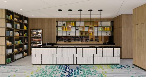 a kitchen with a large island in a room at Holiday Inn & Suites Vientiane by IHG in Vientiane
